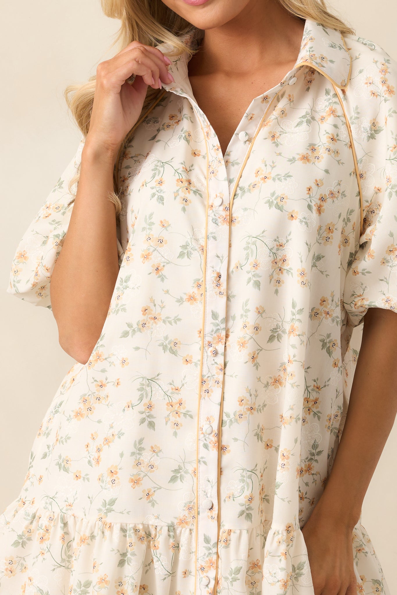 A zoomed-in view of the button front and collar, highlighting the crisp tailoring and polished details.