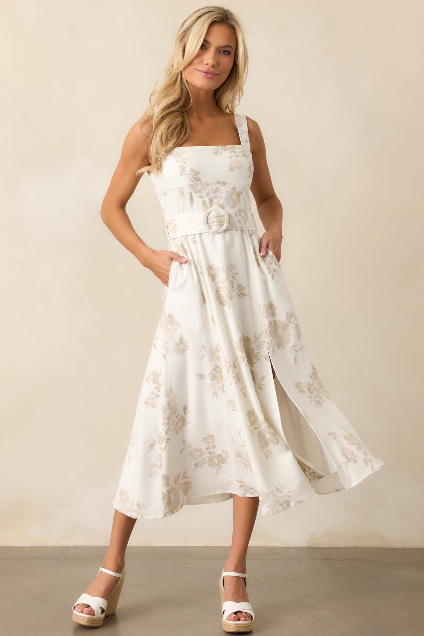 A front-facing shot emphasizing the belt waist detail, showcasing how it defines the shape while complementing the straight neckline and wide straps.