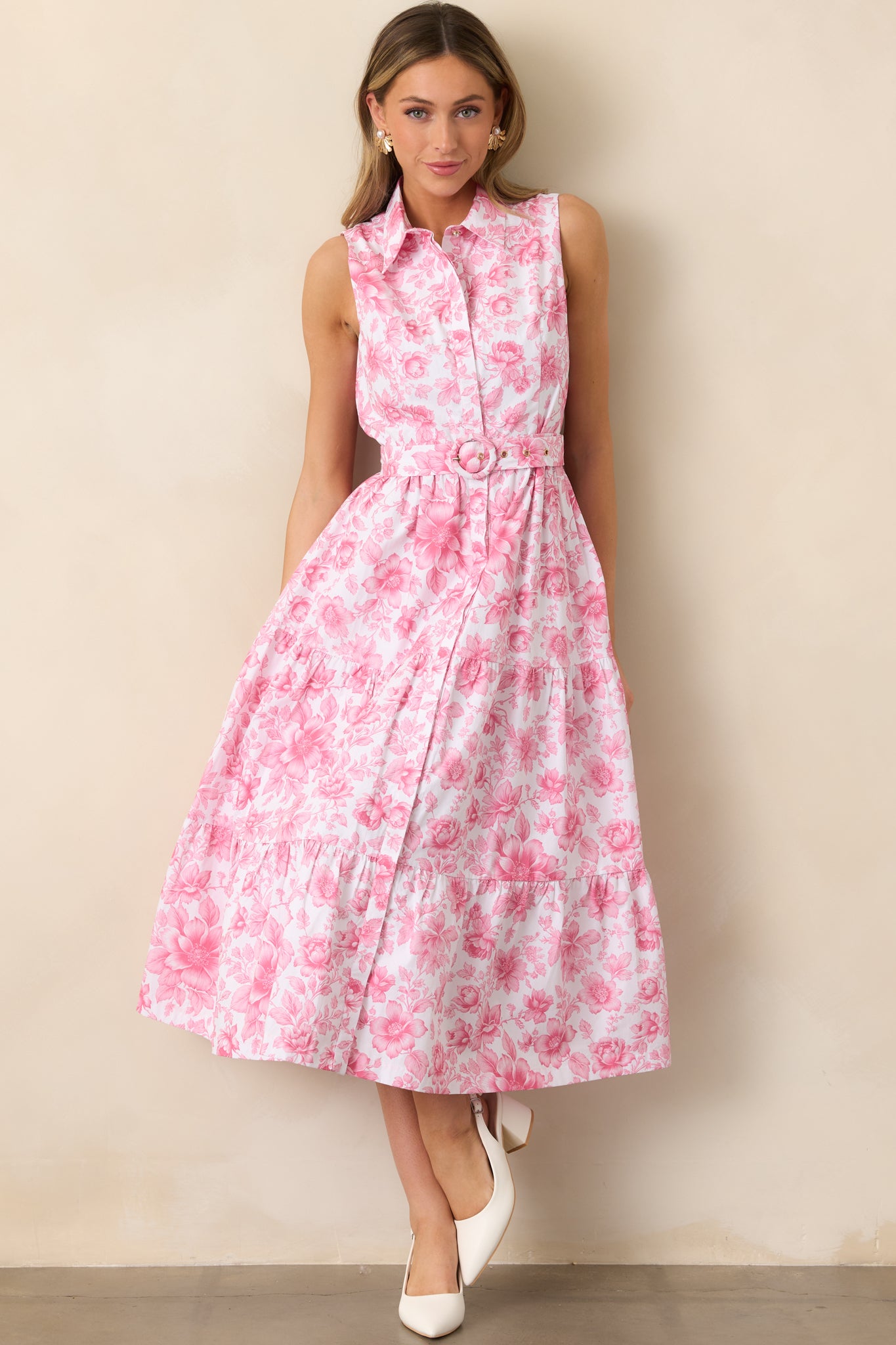 A versatile maxi dress featuring a sleek collared neckline, an adjustable belt, and hidden functional pockets.