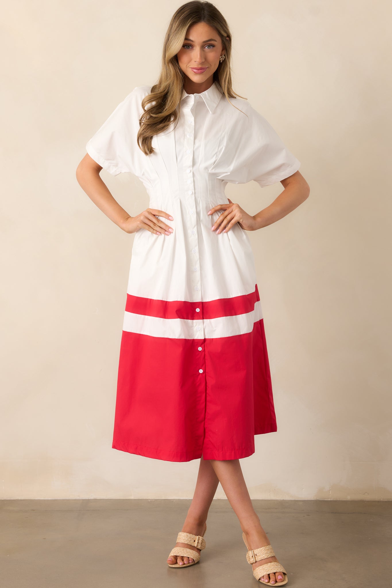 A front-facing view of the ivory midi dress showcasing the collared neckline, button front design, and elastic waistband.