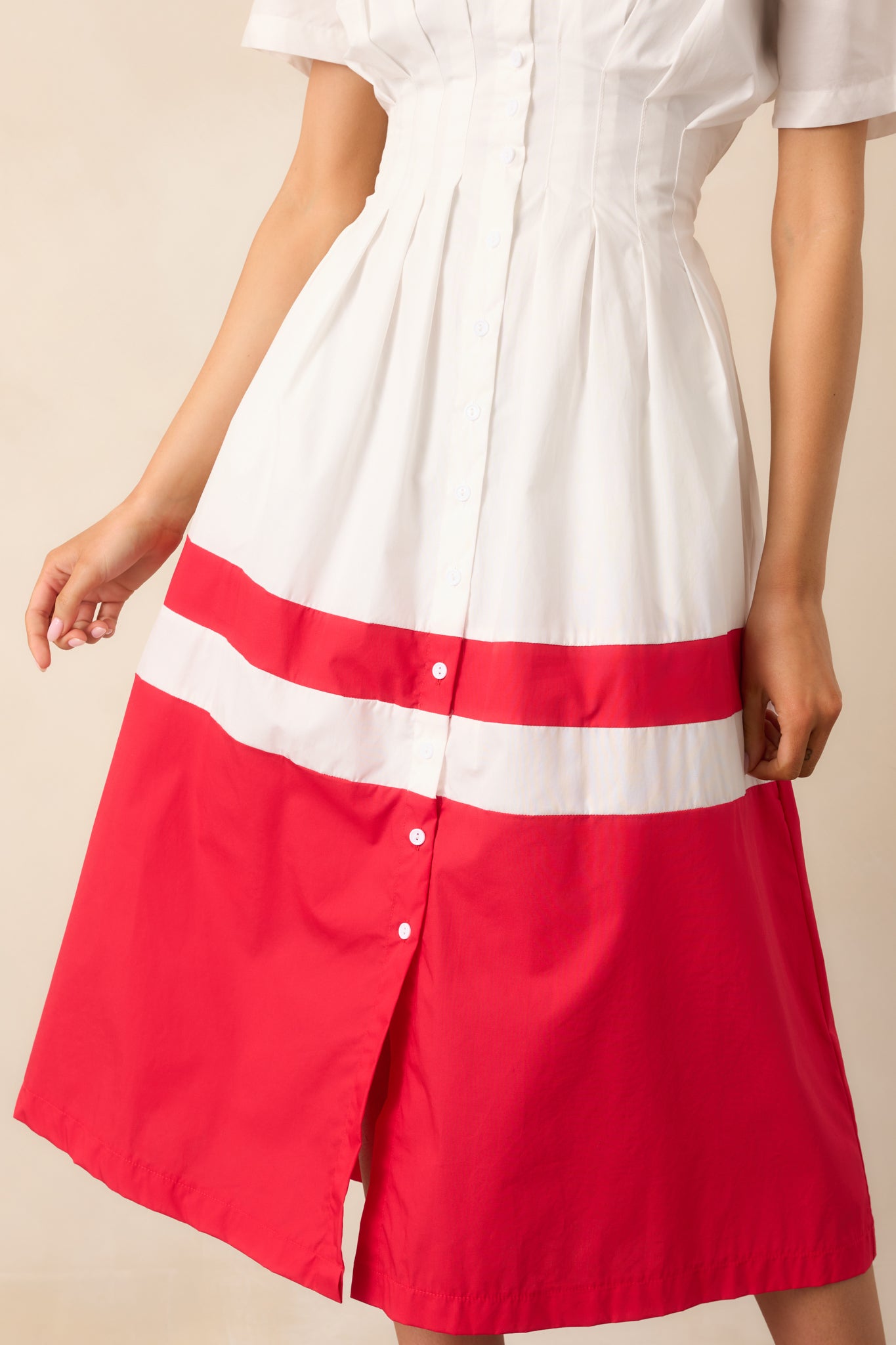 A detailed close-up of the button front design and elastic waistband, emphasizing the fabric and color contrast.