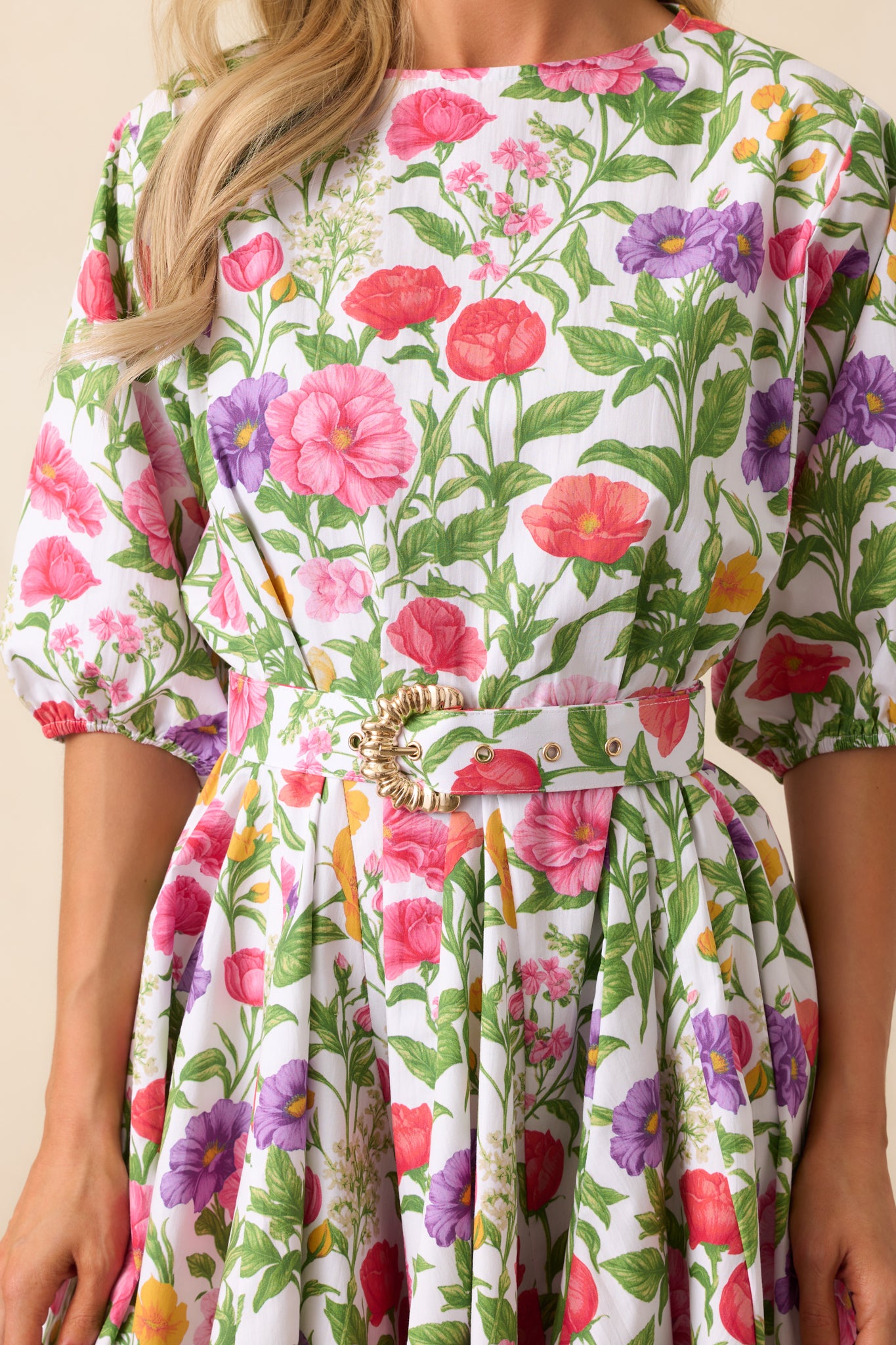 A close-up of the fabric and floral pattern, highlighting the texture and print of the dress.