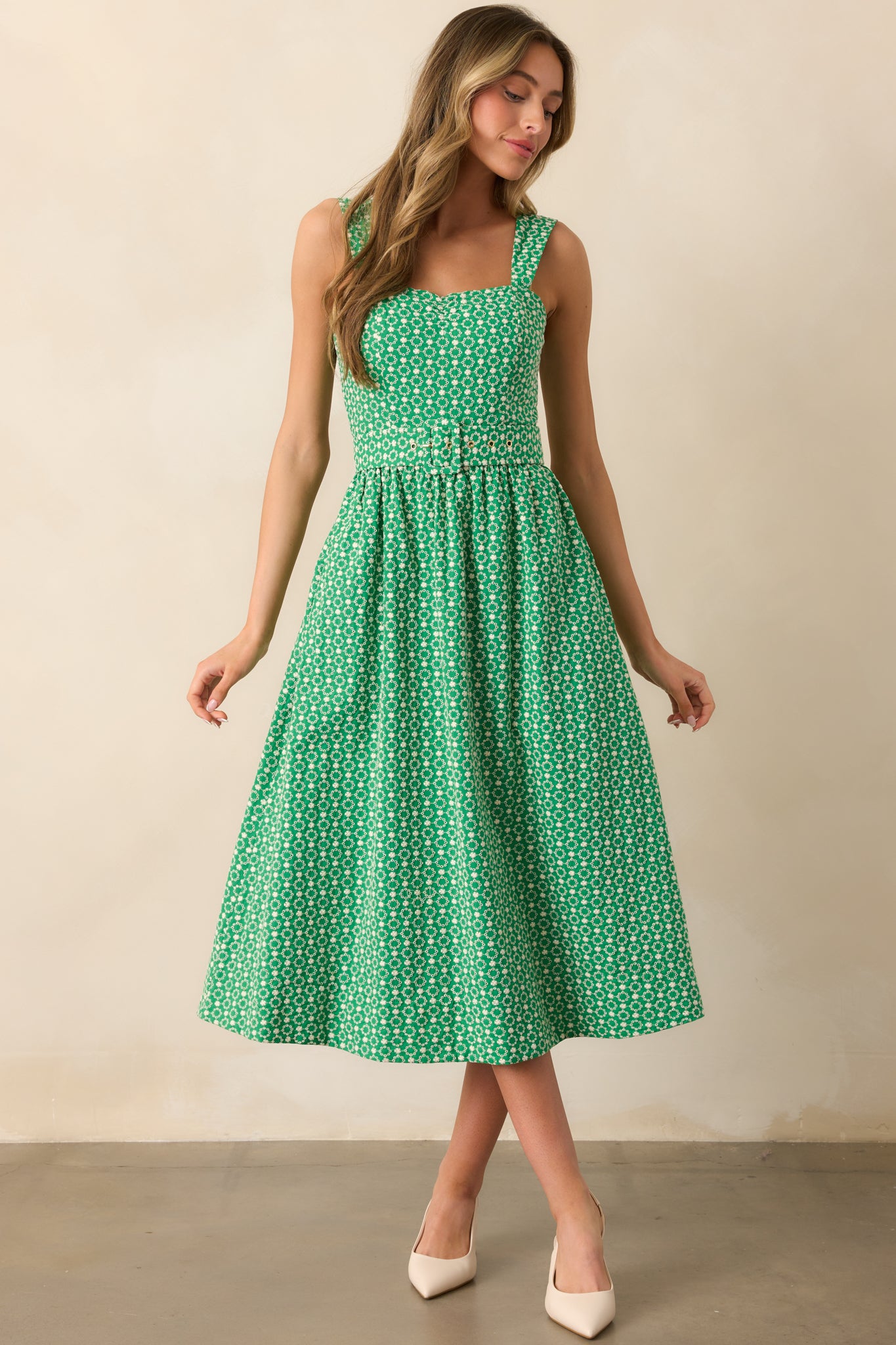 A front view of the dress, emphasizing the included matching belt with a square buckle.