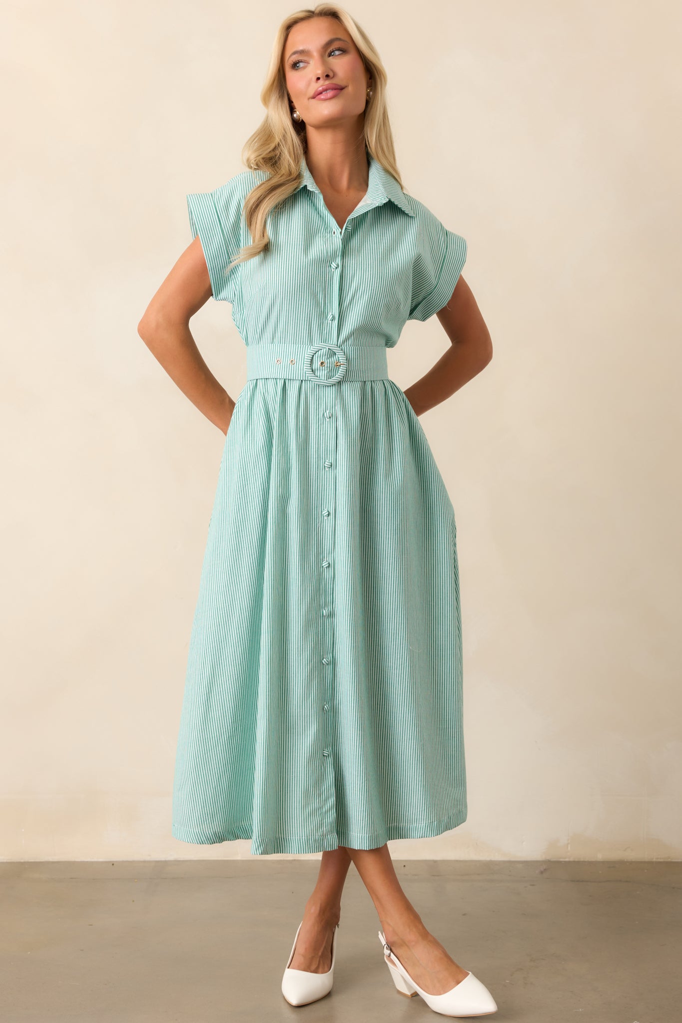 A front-facing view of the grass green dress, showcasing its collared neckline and structured silhouette.